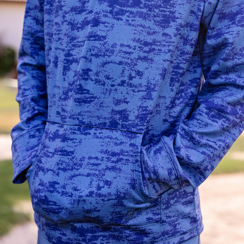Turtles and Tees blue patterned hoodie on a boy with a blurred background