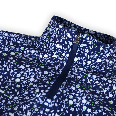 Zip collar on a Turtles and Tees blue floral long sleeve toddler dress