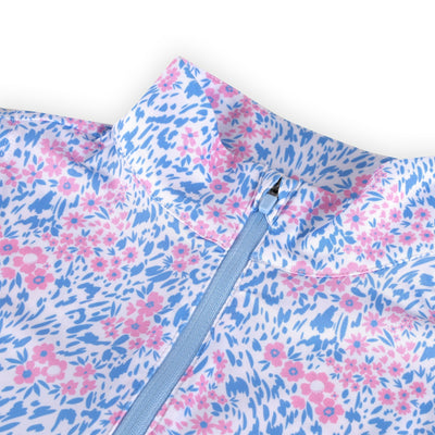 A mock neck collar of a blue and pink floral golf dress