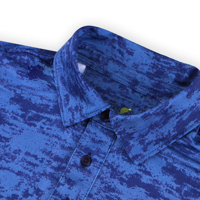 Collar detail of a Turtles and Tees navy blue print polo