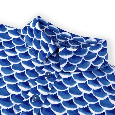 Collar detail of a Turtles and Tees white and blue fish print golf polo